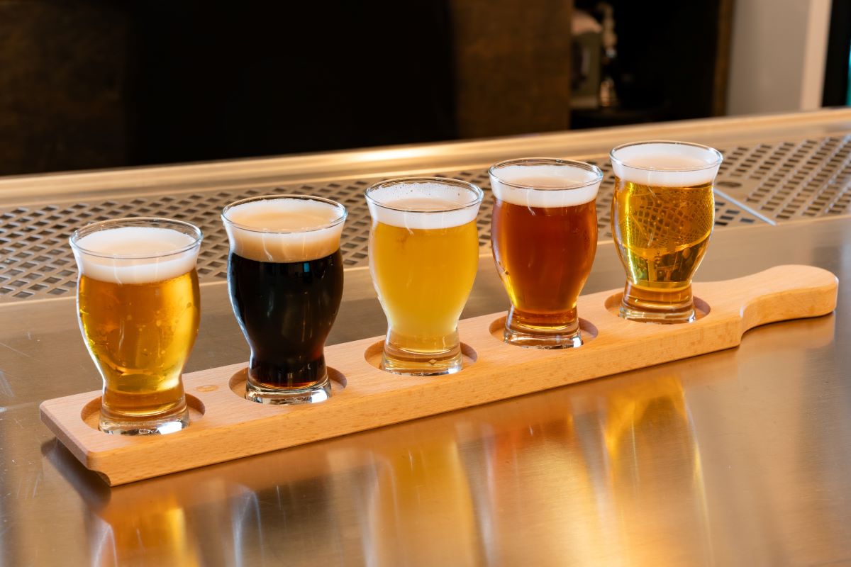 Light and dark beers on a wooden tray