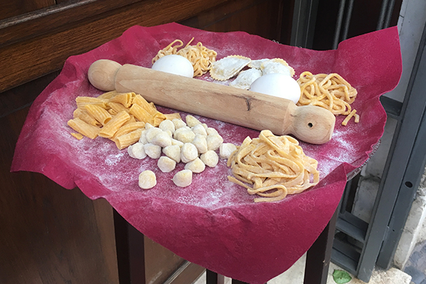 Fresh pasta and a rolling pin on display at one of the restaurants in Vatican City.