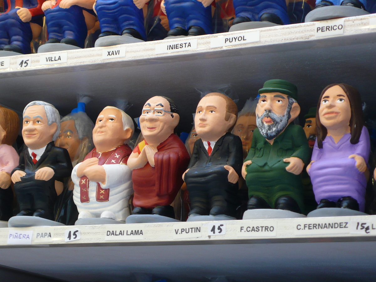 Small figurines of famous people on a store shelf