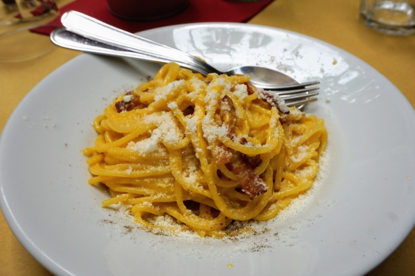 Responsible tourism in Rome means eating locally. Consider trying a local specialty, like carbonara.