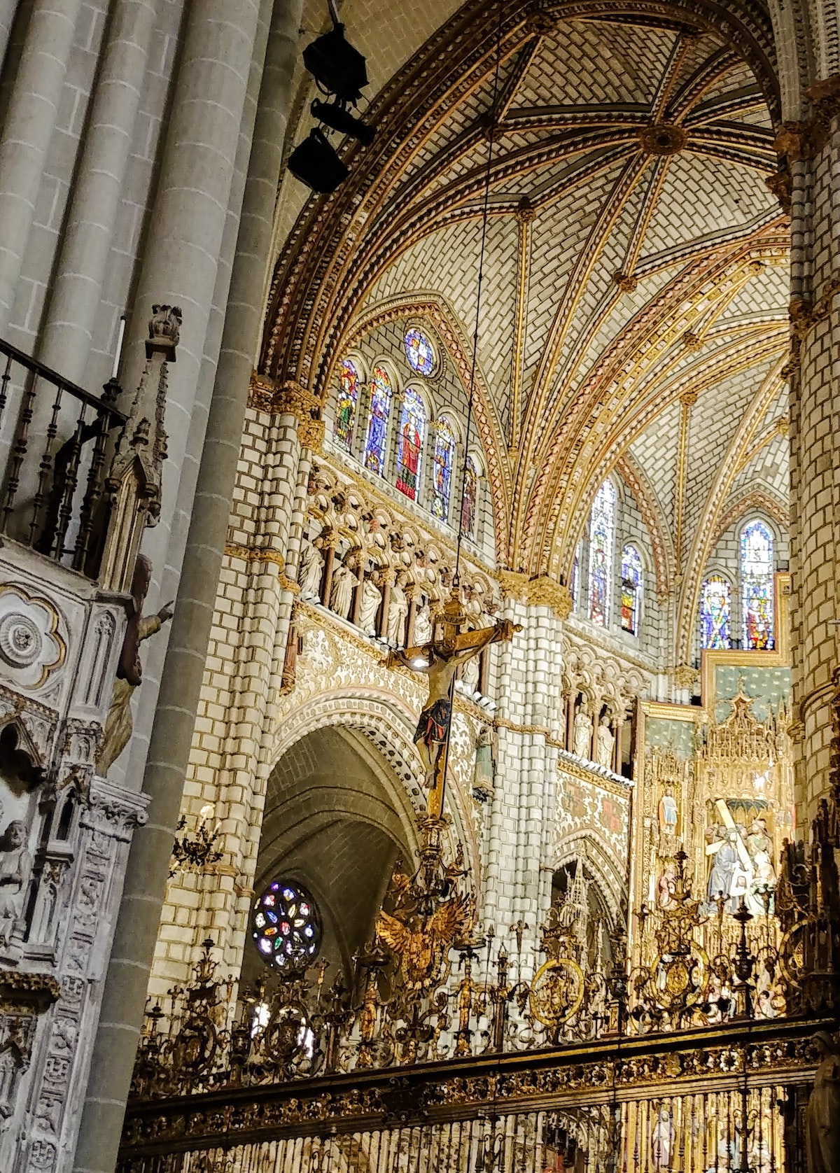 Elaborate interior of Gothic cathedral with Christian decorations.