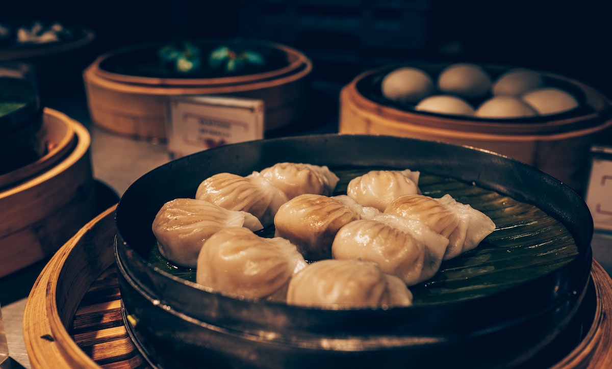 Chinese dumplings served on a black dish
