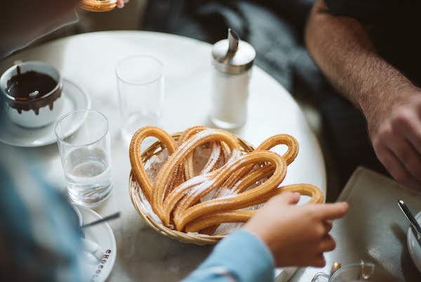 Basket of churros dusted with sugar