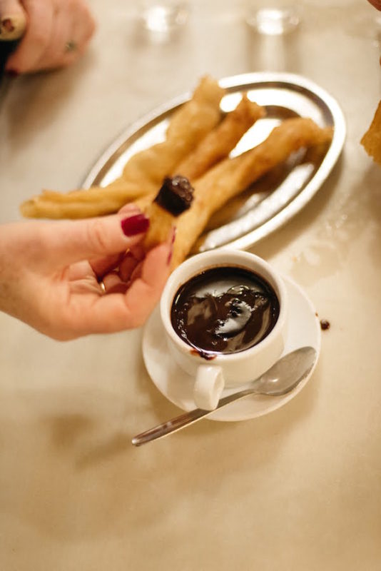 Dipping churros into hot chocolate