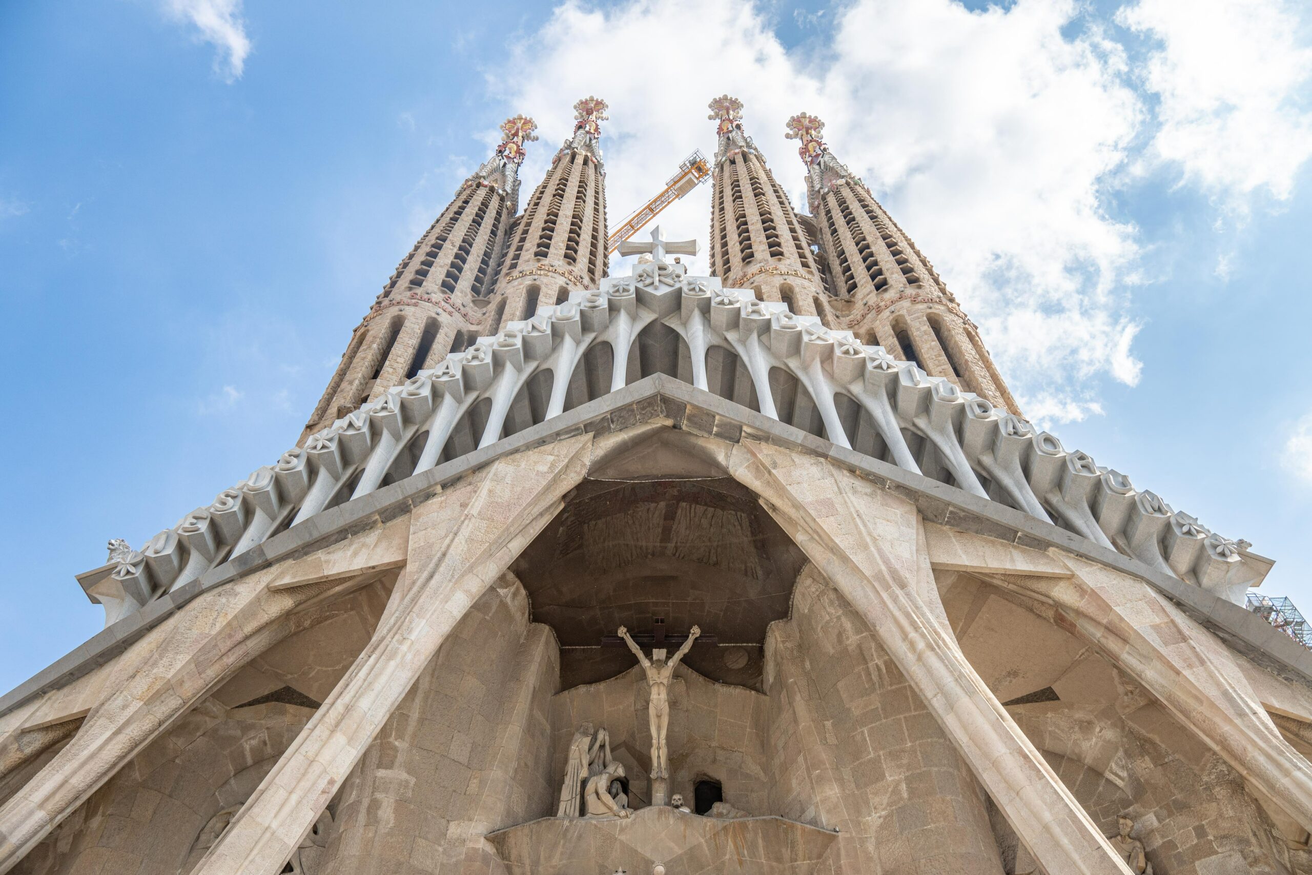 The entrance of La Sagrada Familia looking up