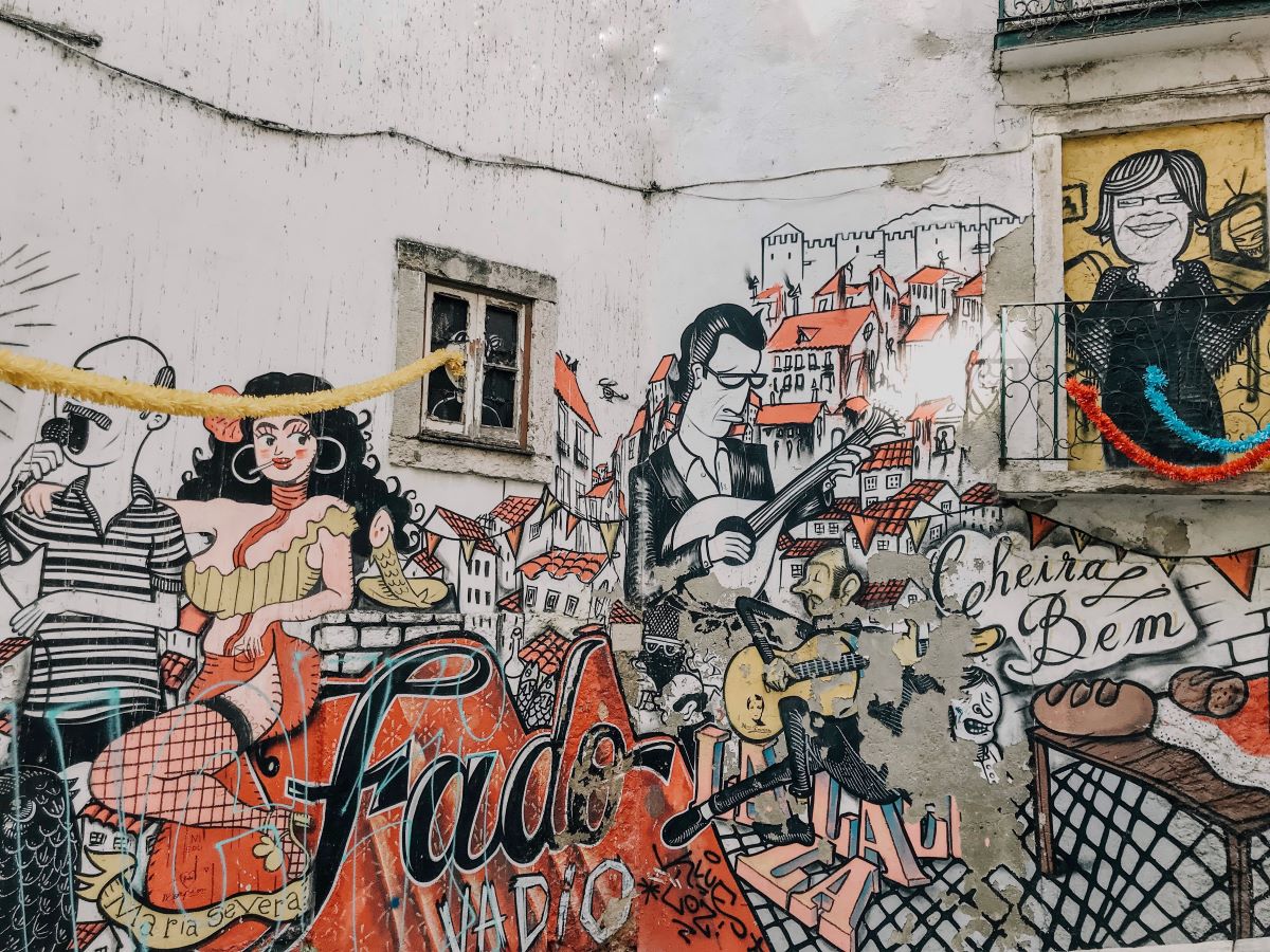 mural of people playing fado in Lisbon