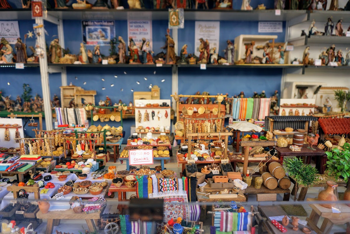 Many small objects for sale at a market stall