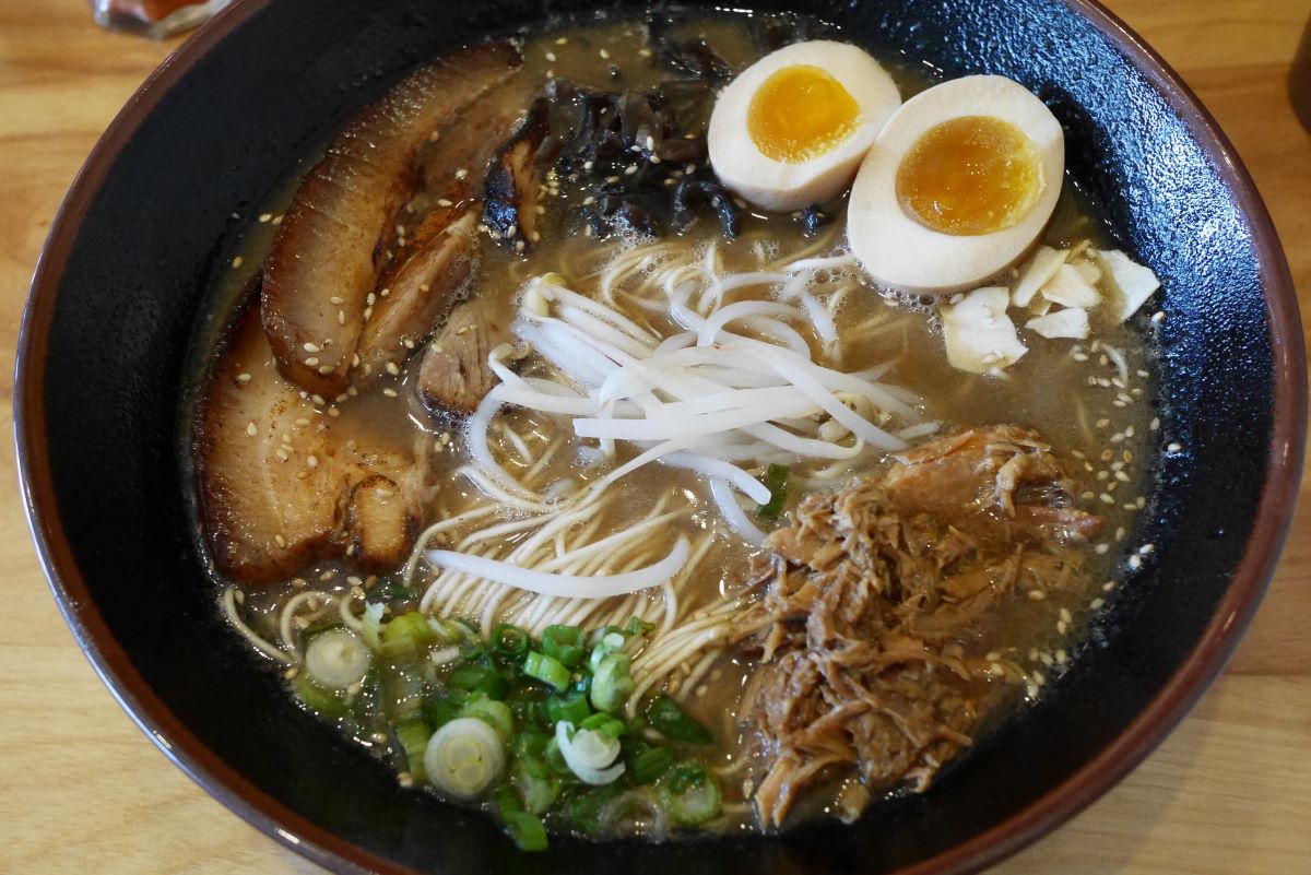 ramen bowl with noodles, eggs and greens