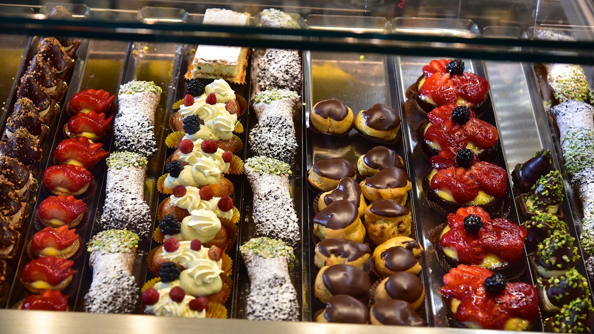 Window display of trays of different sweet pastries