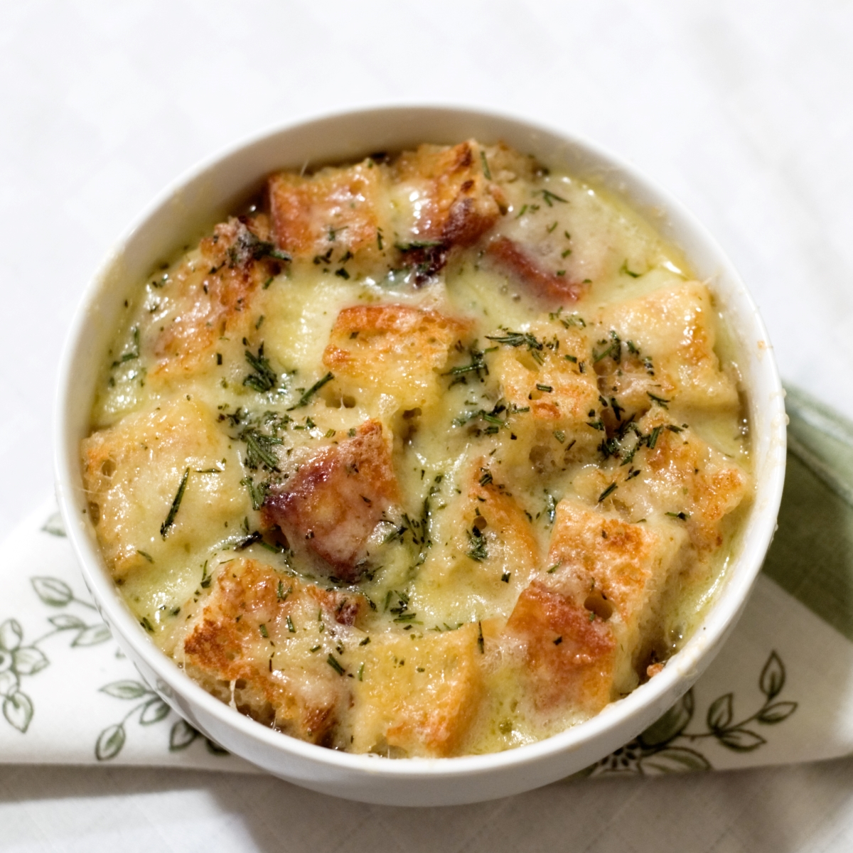 french onion soup in white bowl