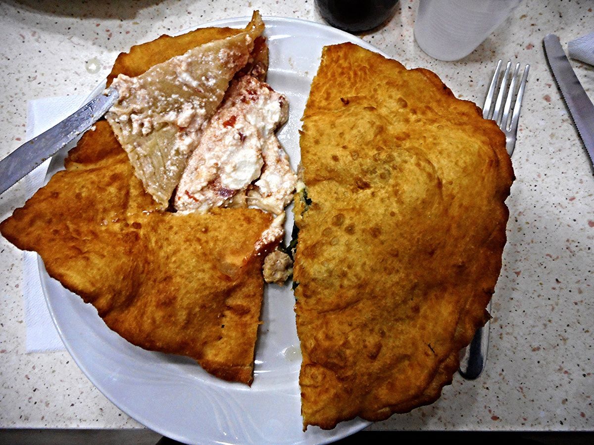 fried pizza cut in half