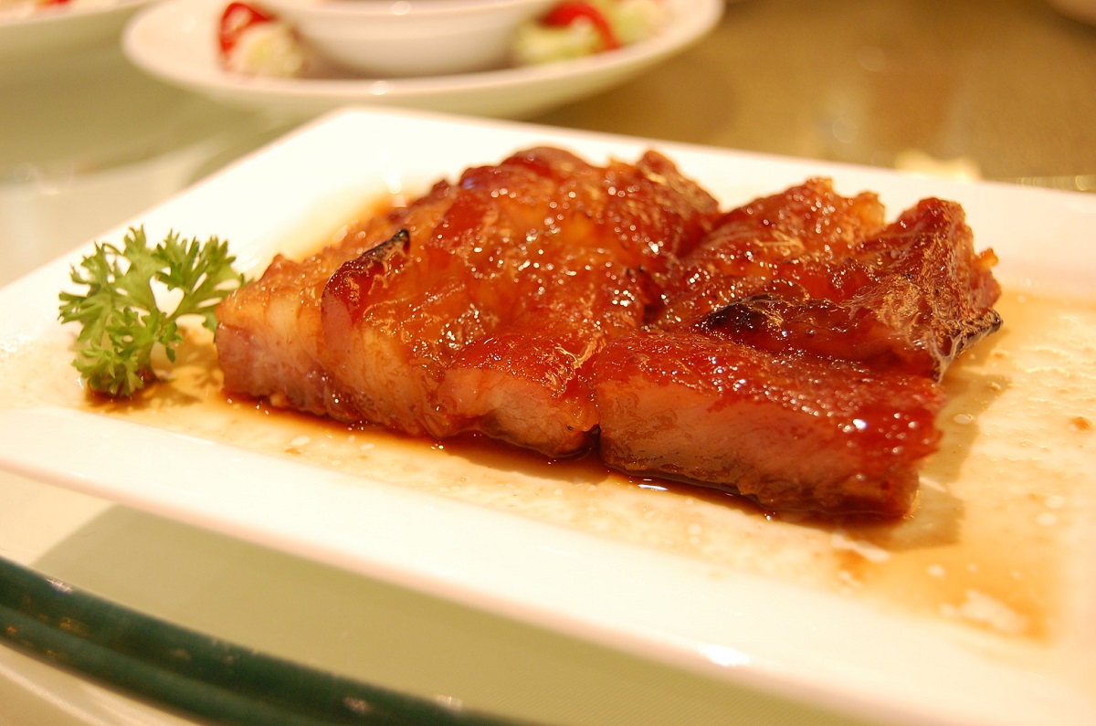 Plate of slow roasted Chinese pork on a white plate