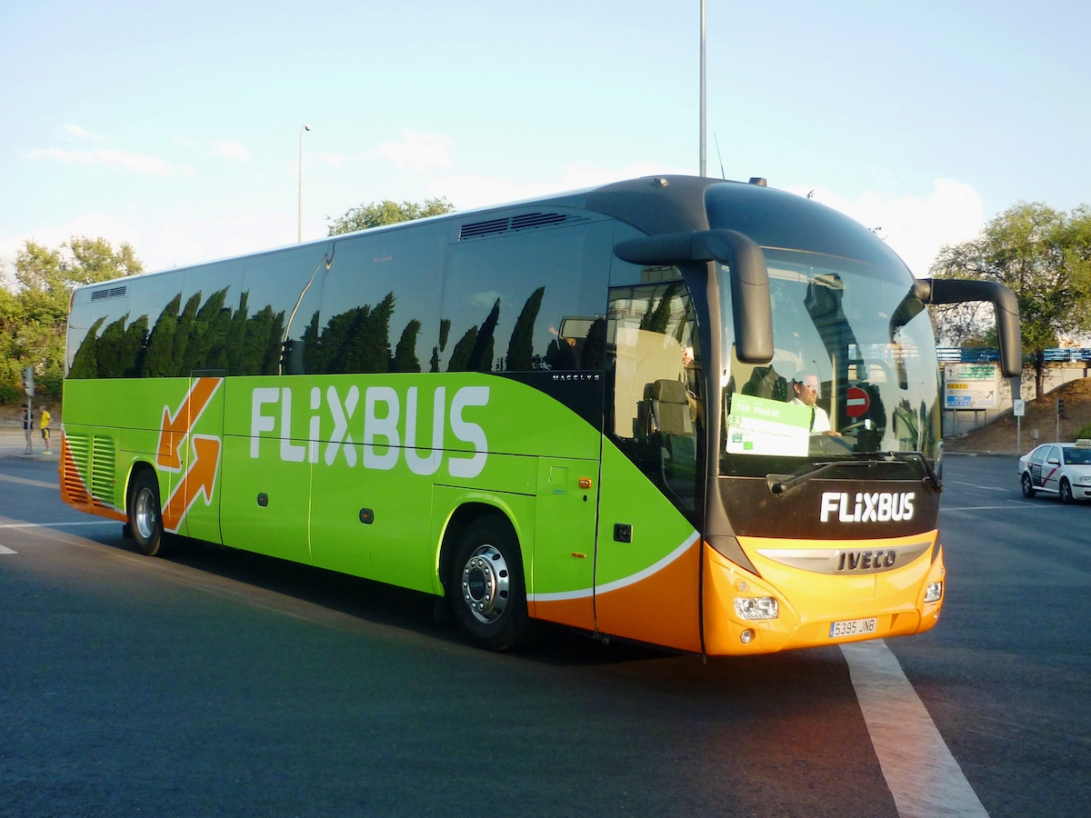 Bright green and orange bus with the word Flixbus in white lettering