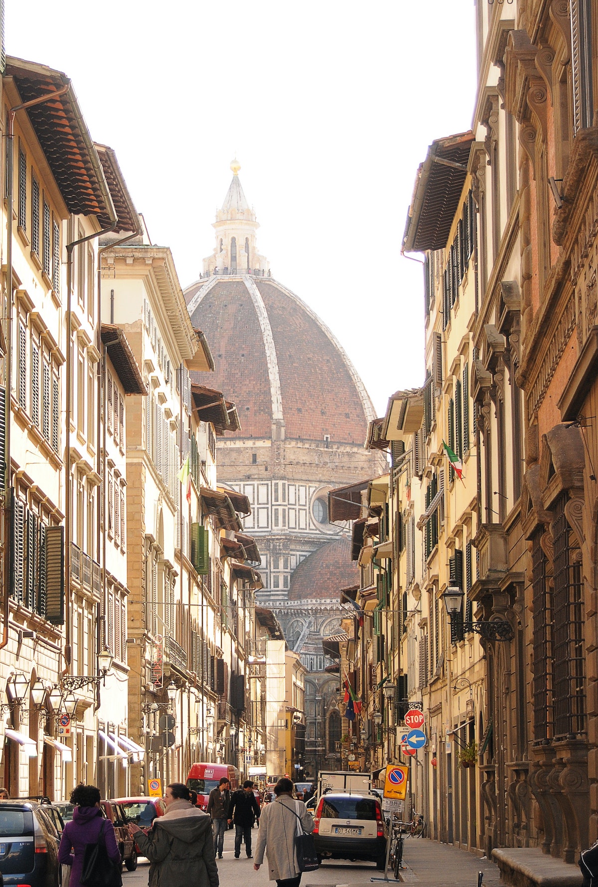 City streets of Florence, Italy with the cathedral dome visible in the background