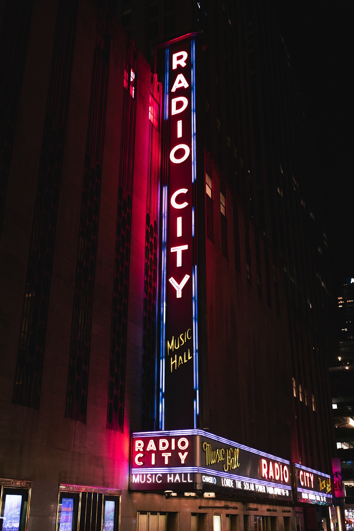 Night scene with neon sign advertising Radio City Music Hall