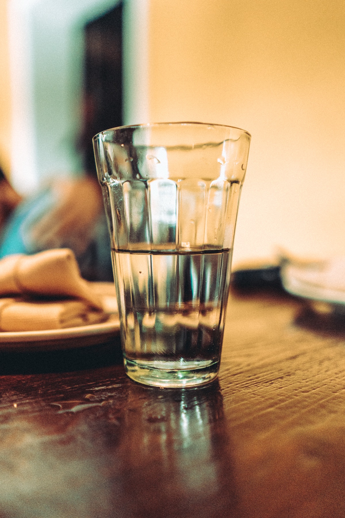 Clear glass of water on a wooden table