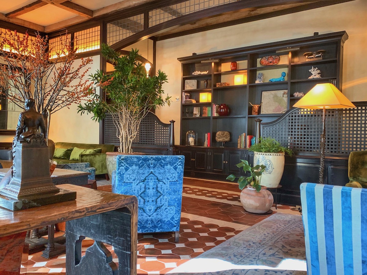 Interior of a hotel lobby with soft wood accents and blue details