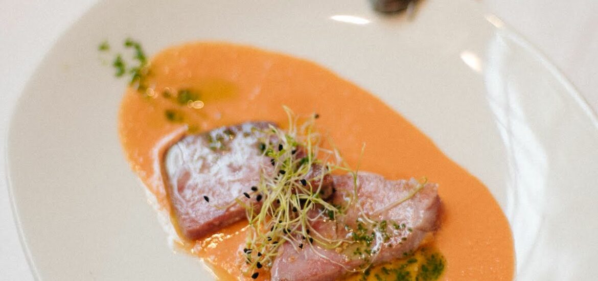 Grilled tuna on a bed of chilled tomato soup.