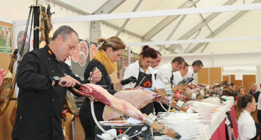Ham being sliced at the fair in Aracena, Spain.