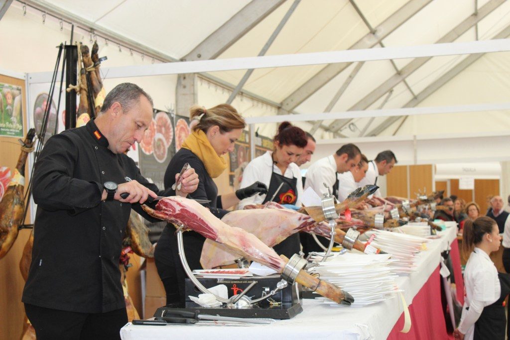 Ham being sliced at the fair in Aracena, Spain.