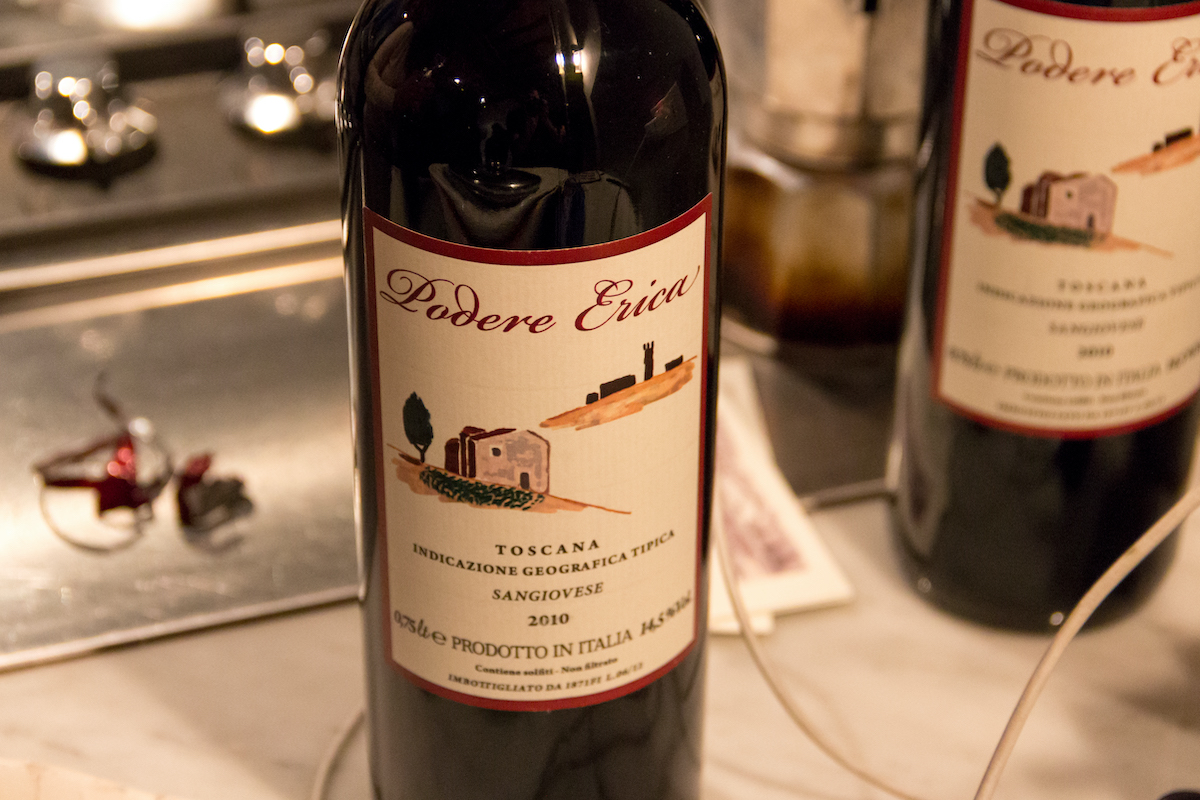 Bottle of Italian wine with a label depicting a Tuscan estate
