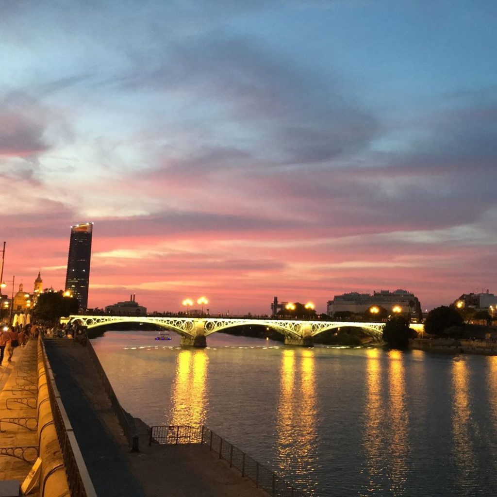 The sunset on Calle Betis makes it one of the most Instagrammable spots in Seville.