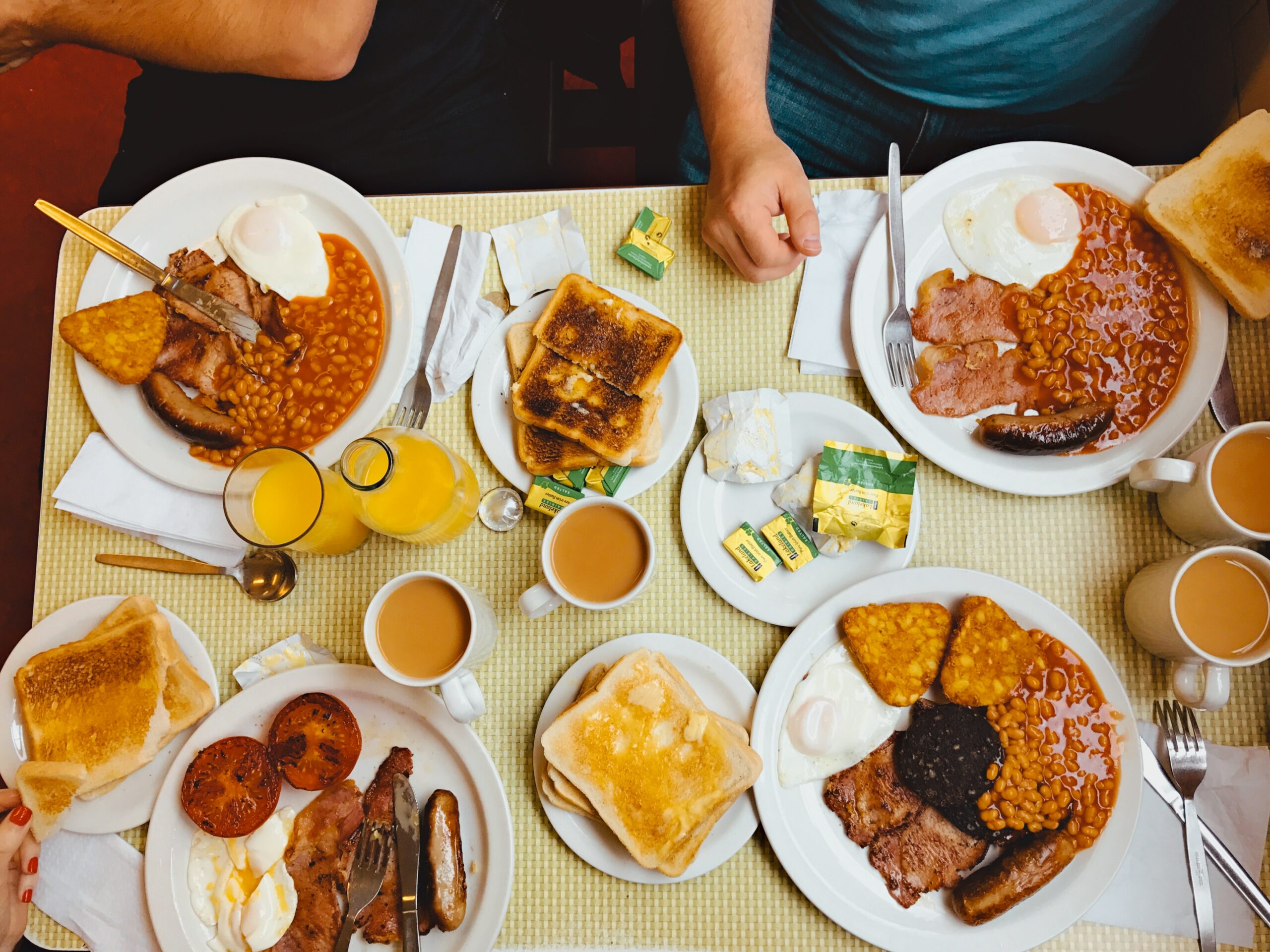 Overhead shot of Regency cafe full english breakfast with beans, sausages, bacon and eggs