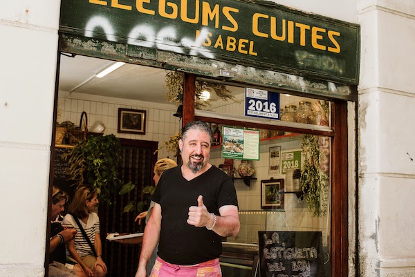 José, owner of La Botigueta food shop, in front of his business