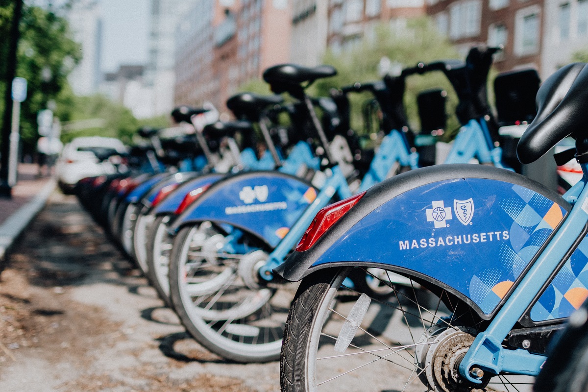 Row of blue bikes in Boston waiting to be picked up as part of a public ride shar