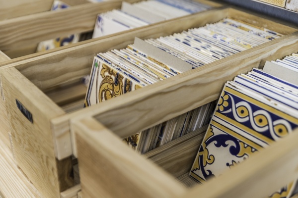 Box of assorted industrial tiles at shop Cortiço & Netos, one of the places to buy Lisbon souvenirs - responsible tourism guide
