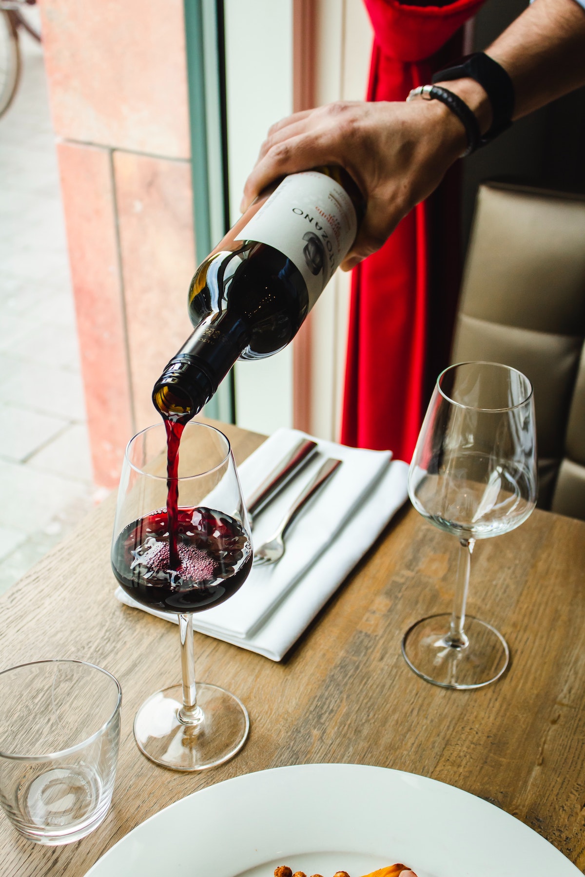 Red wine being poured into a glass