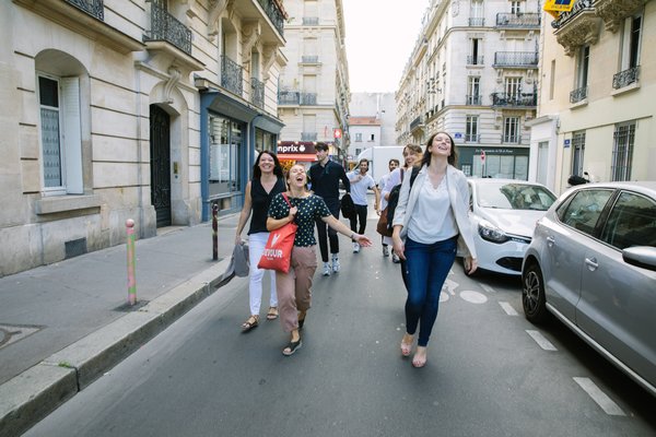 Small tour group walking through Paris