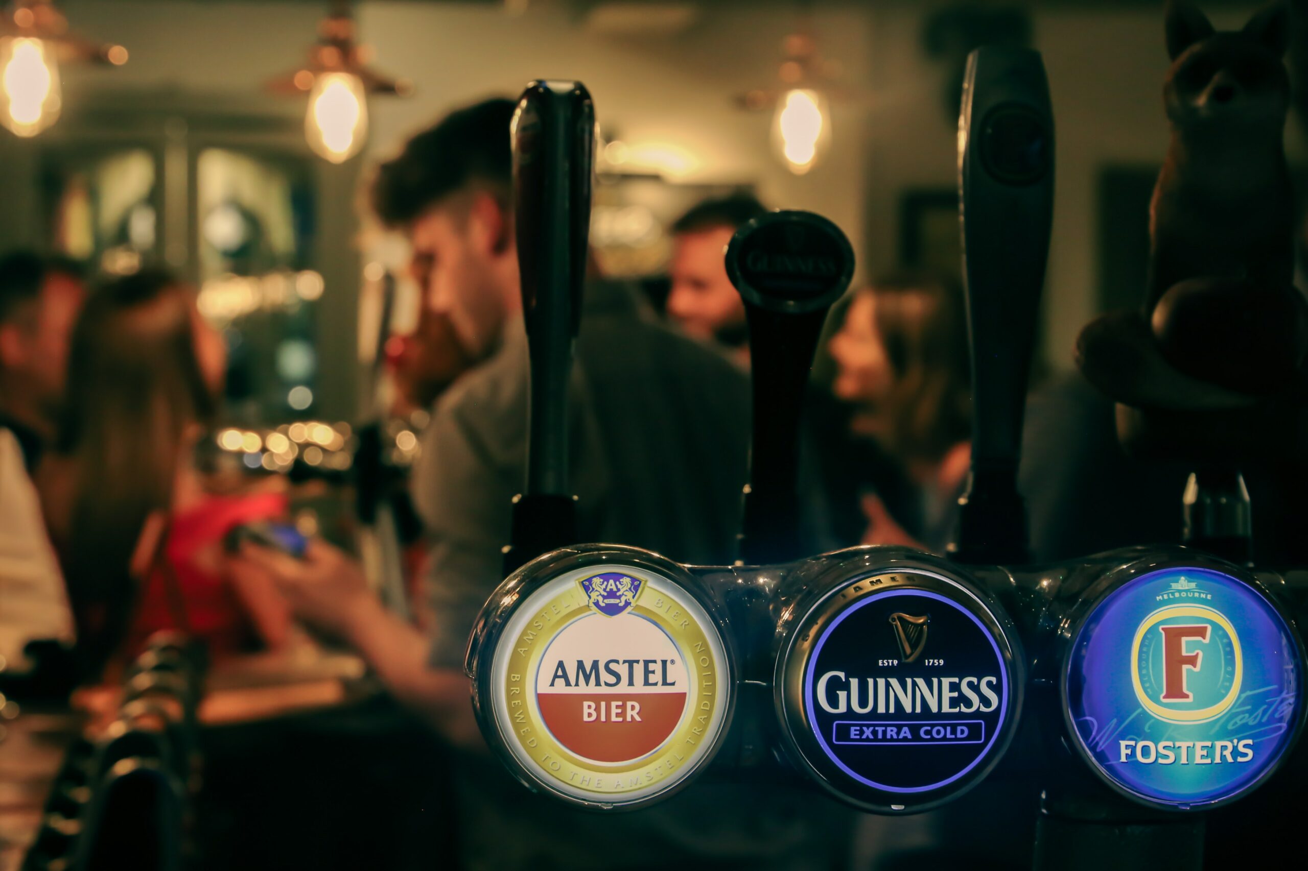 Inside of a pub with beer taps in shot 