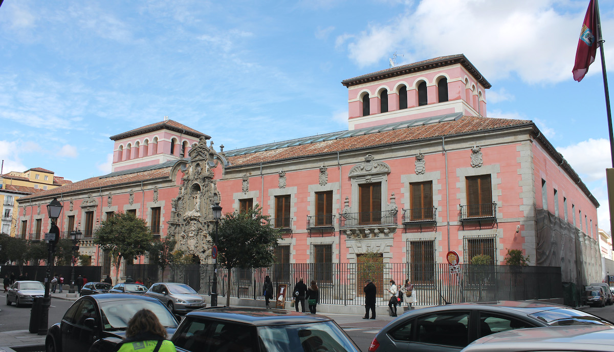 Large pink building constructed in the Baroque style.