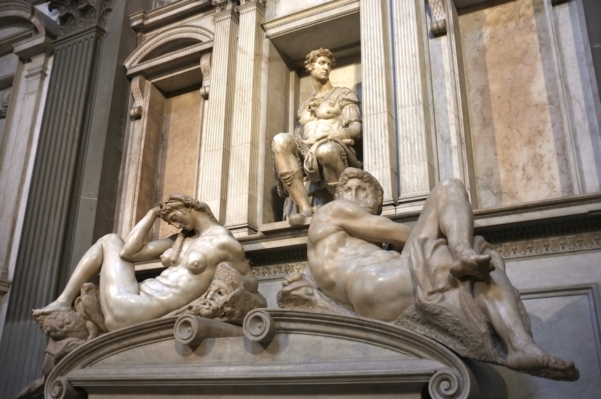 Three large marble sculptures of humans at the Medici Chapels in Florence