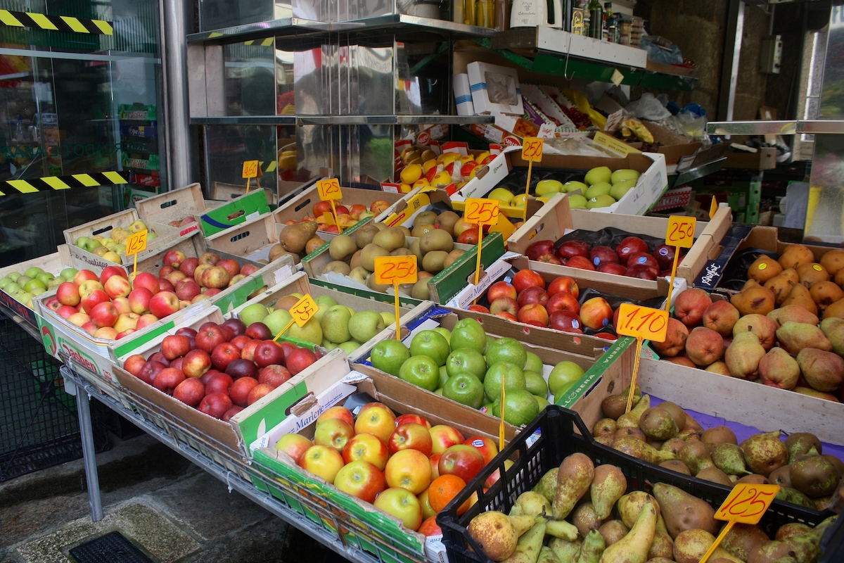 Boxes of fresh fruit for sale at a market stall
