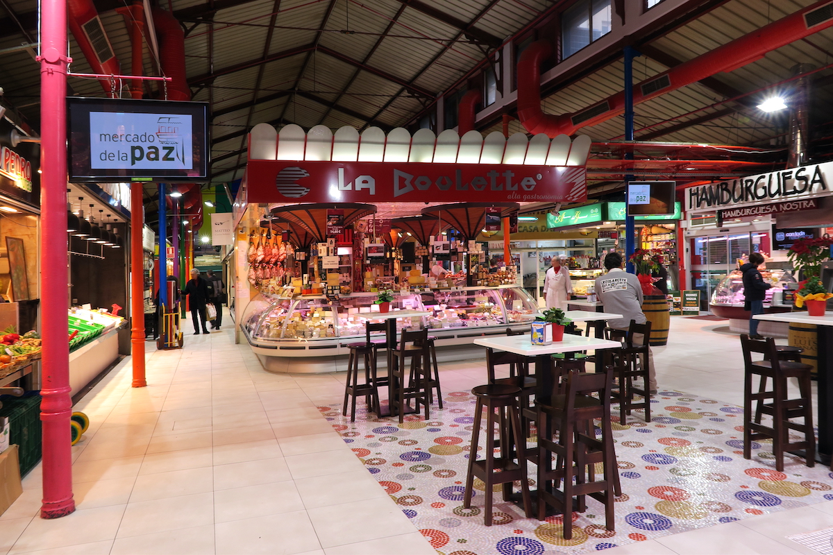 Dining space among stalls in a food market