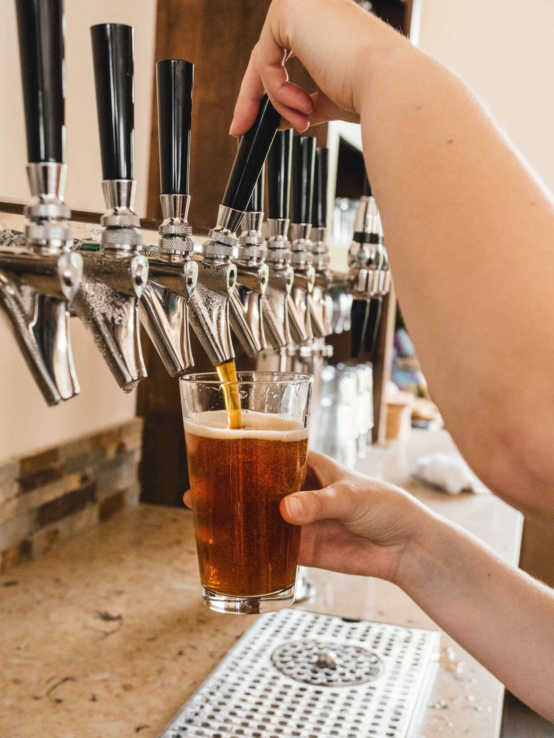 A pint of craft beer in Italy being poured