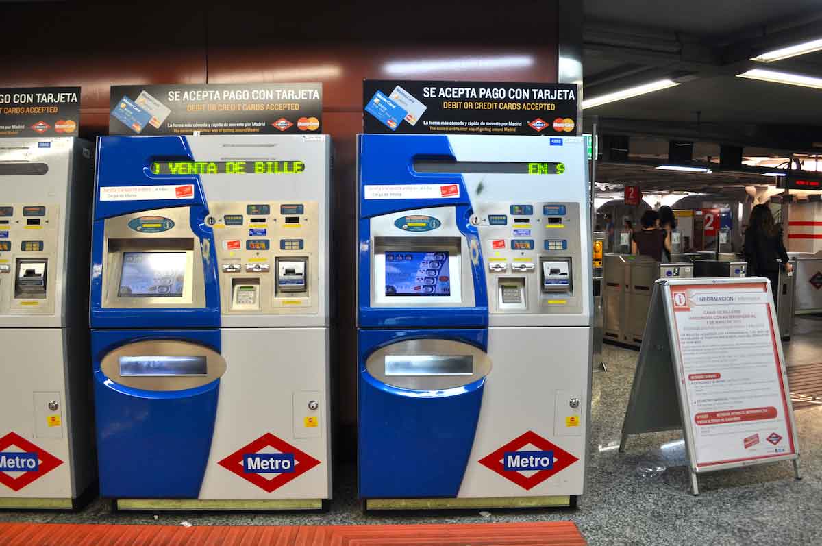 Electronic ticket machines inside a Madrid metro station.