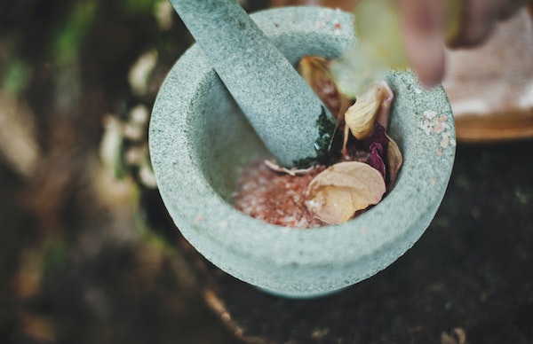 Crushing ingredients with a mortar and pestle