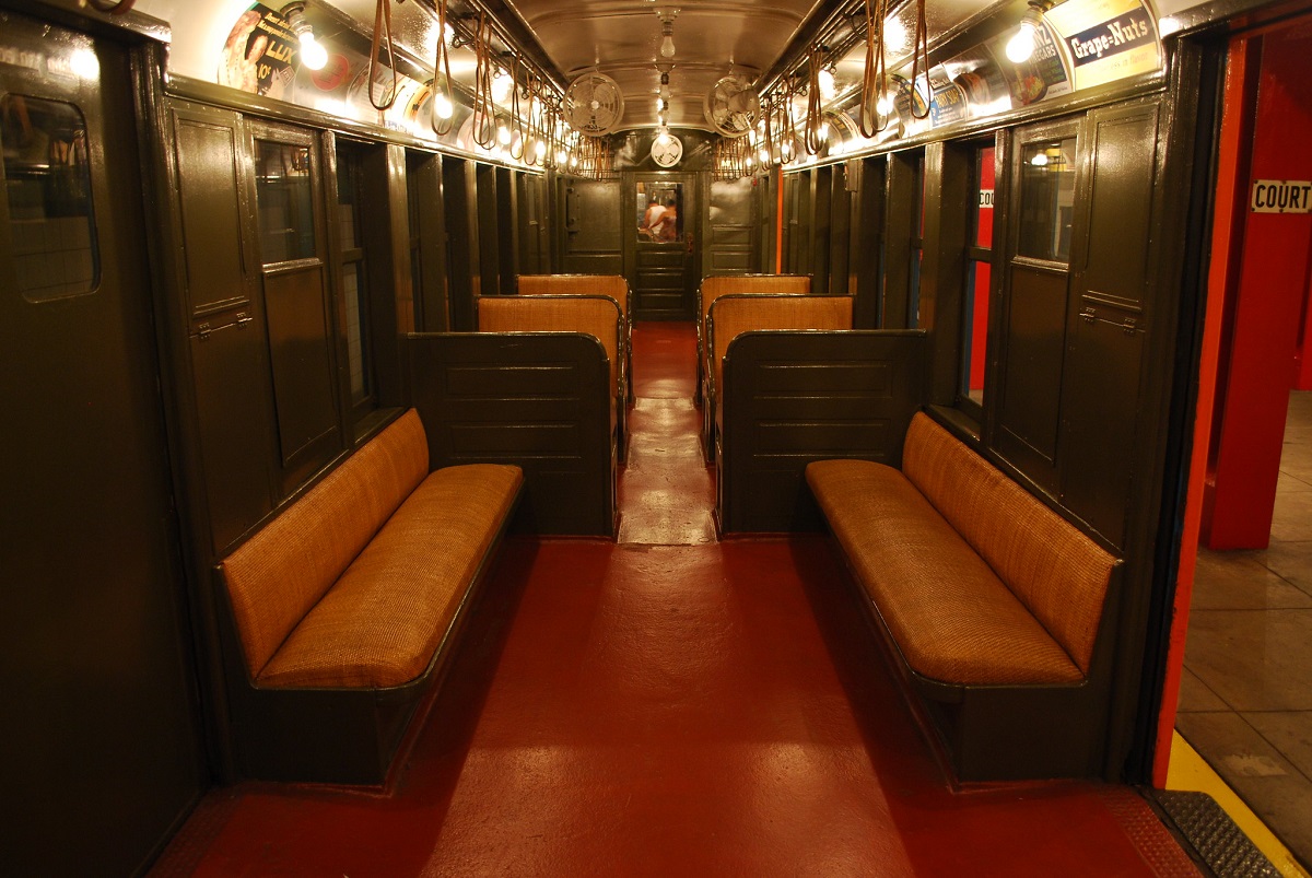 Dark interior of an old subway car, illuminate dimly by flash bulbs