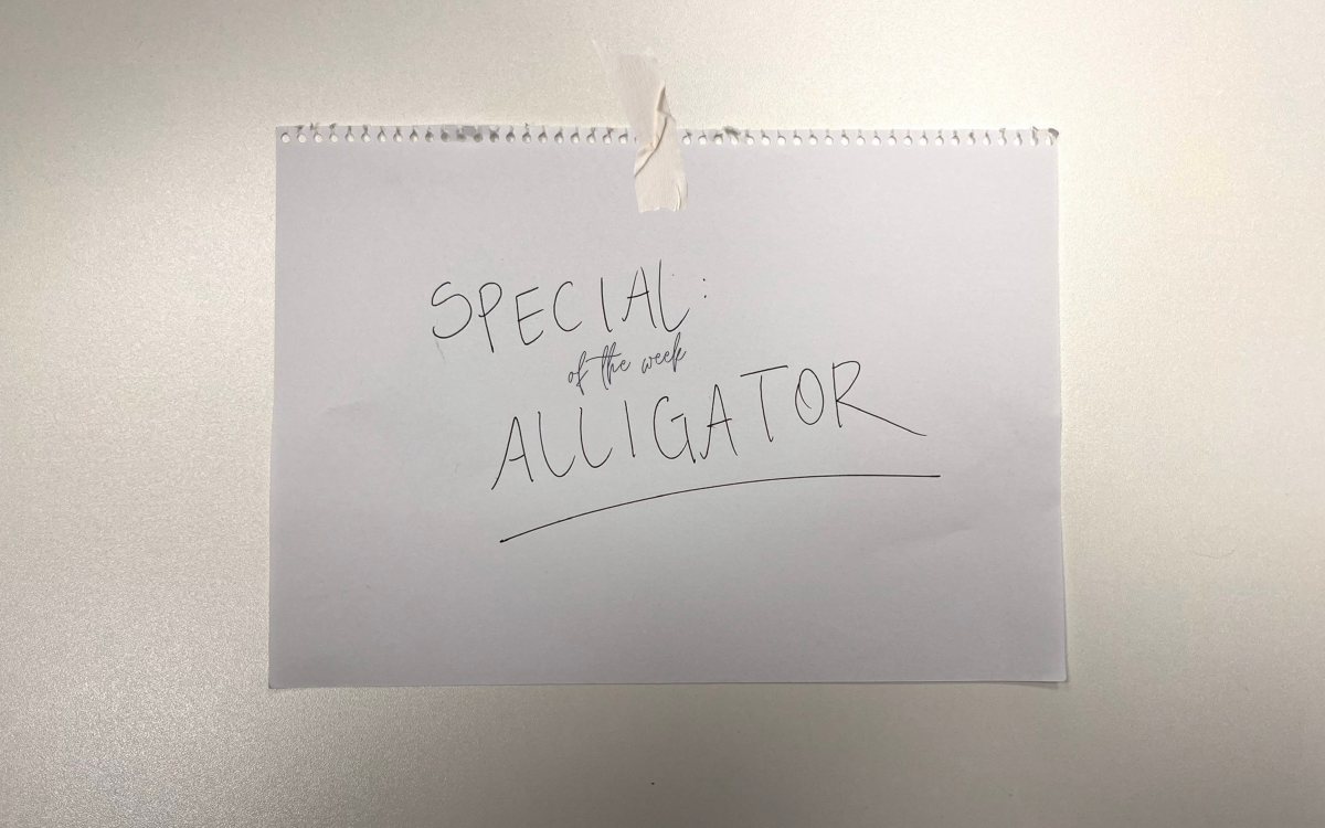 sign displaying that alligator is a special of the week