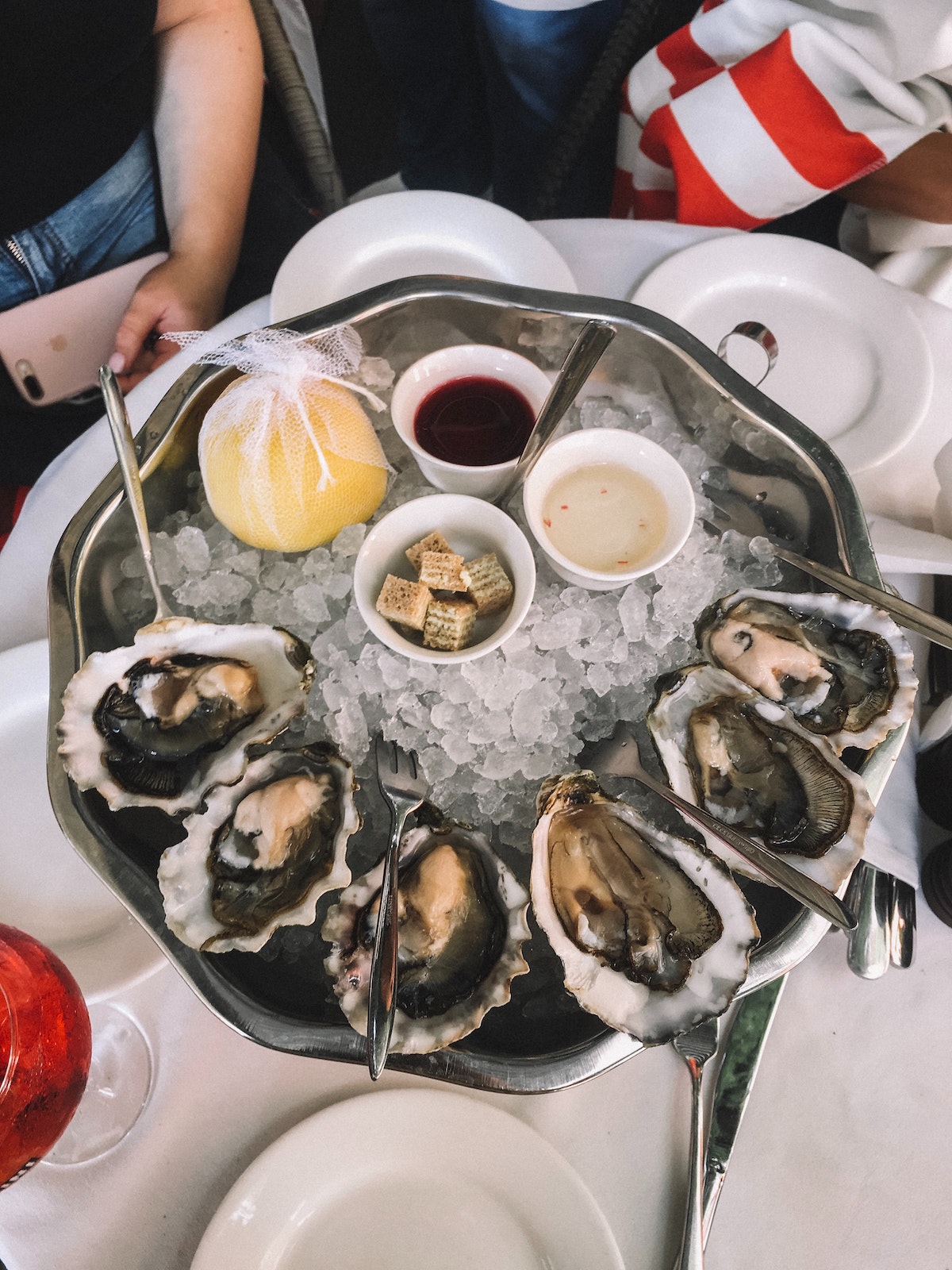 Overhead shot of oysters in a metal ice tray