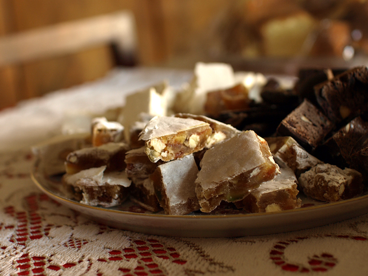 Tuscan dessert with fruit and nuts chopped into small pieces and served on a plate