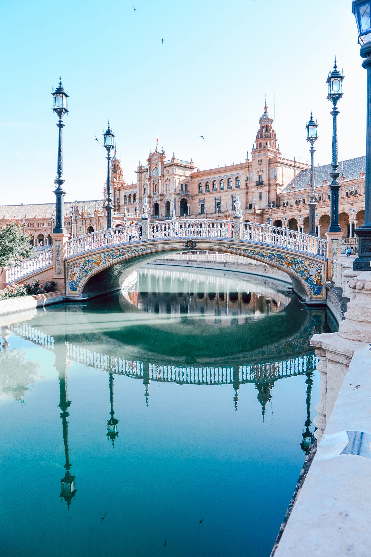 Plaza de Espana in Seville with water and lampposts