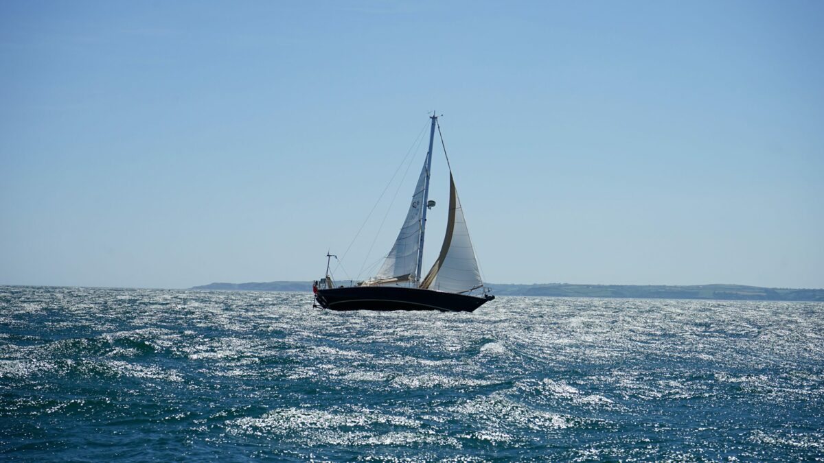 white sailboat at open sea