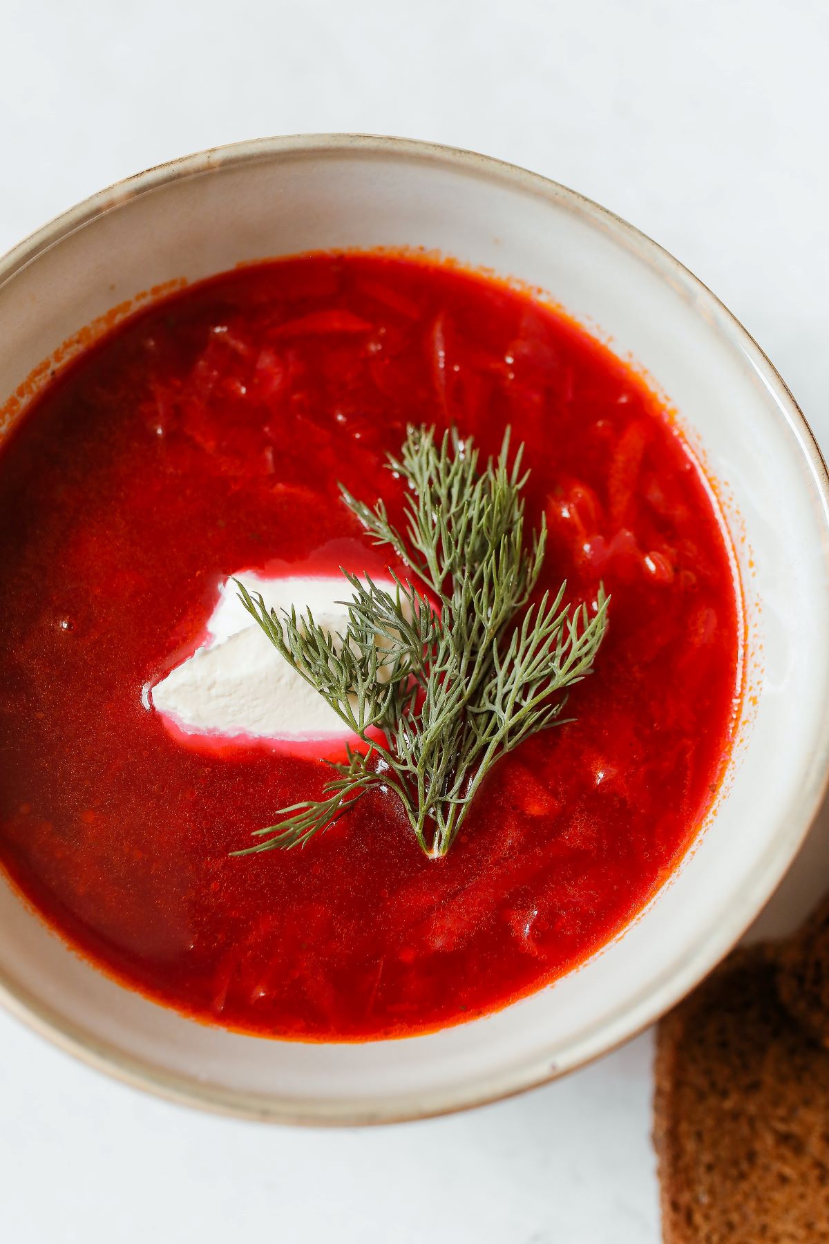 red soup in white ceramic bowl