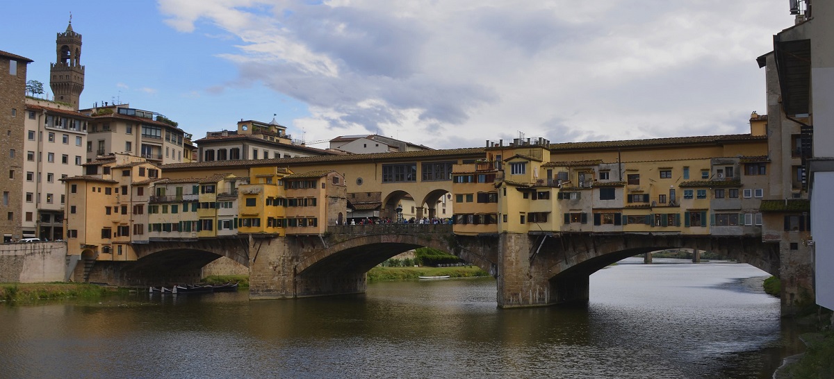 The Ponte Vecchio on the Arno River in Florence on a sunny day