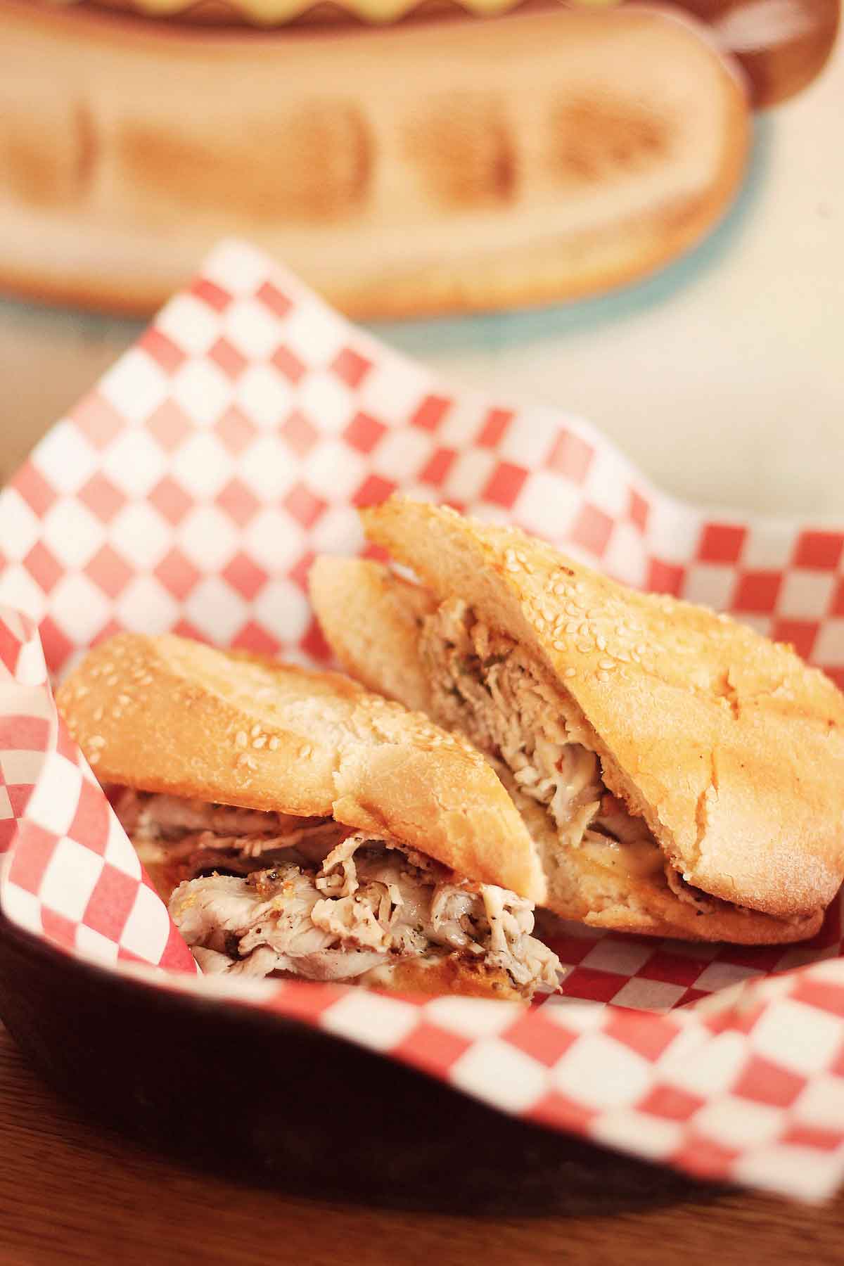 Pork sandwiches served on red and white checkered paper