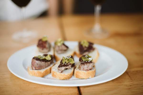 Steak pintxos, a bite of steak on top of bread, from a bar in the Old Town of San Sebastian
